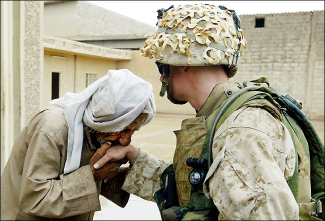An Iraqi thanked Cpl. Joseph Sharp after he and other marines delivered food and water to civilians, Falluja, April 19, 2004.