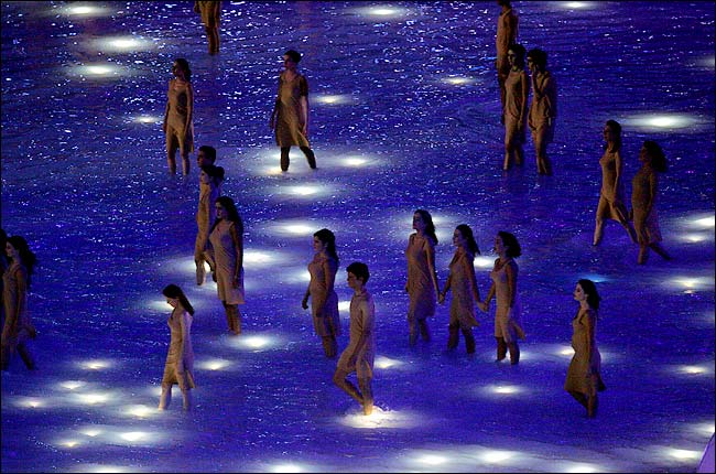 A spectacle shows Greece as a gift of nature, the main Olympic stadium covered with water during the Athens 2004 Olympic Games opening ceremony, August 13, 2004.