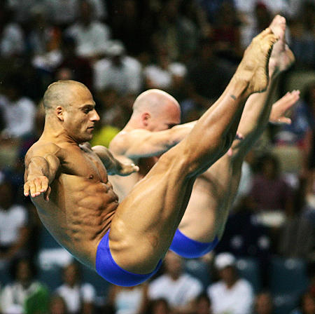 Britain's Tony Ally and Mark Shipman dive in the men's synchronised 3 metre springboard final at the 2004 Summer Olympic Games, Olympic Aquatic Centre, Athens, Greece, August 16, 2004.
