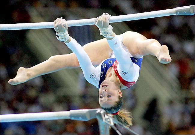 Carly Patterson competing for the United States on the uneven bars, at the 2004 Summer Olympic Games, Athens, Greece, August 17, 2004.