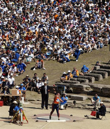 Lieja Tunks of the Netherlands puts her shot during the shot-put final event at the 2004 Athens Summer Olympic Games, the ancient stadium used for Olympic competition for the first time in nearly 16 centuries, Ancient Olympia, Greece, August 18, 2004.