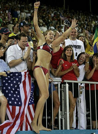 USA's Kerri Walsh celebrates with fans after she and teammate Misty May beat Brazil in the gold medal beach volleyball finals during the 2004 Summer Olympics at Faliro Beach Volleyball Stadium, Athens, August 24, 2004.