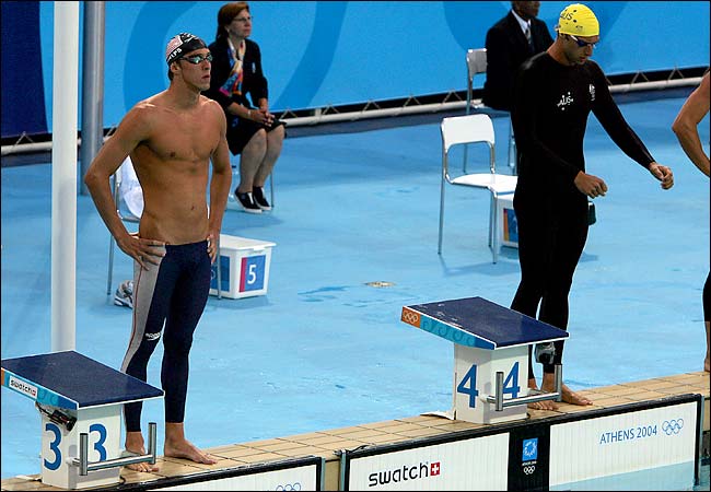 USA's Michael Phelps, left, and Australia's Ian Thorpe before the start of the 200-meter freestyle preliminary round, at the 2004 Summer Olympic Games, Olympic Aquatic Centre, Athens, Greece, August 15, 2004.