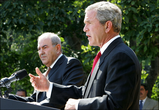US President George W. Bush joined by Iraqi interim Prime Minister Iyad Allawi, speaks to the media in the Rose Garden of the White House during a press conference, Washington, September 23, 2004.