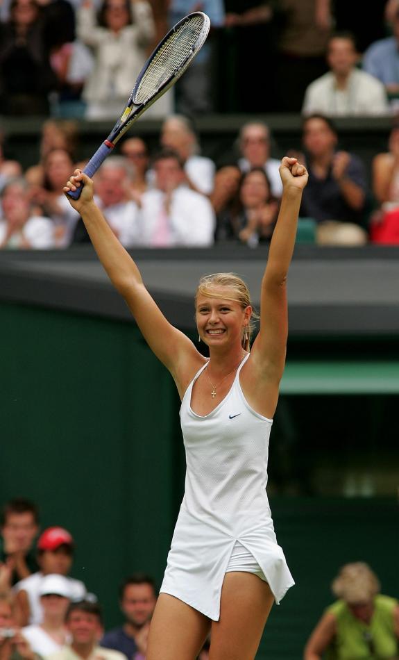 Maria Sharapova of Russia celebrates winning her quarter final match against Ai Sugiyama of Japan at the 118th Wimbledon Tennis Championship, the Centre Court at the All England Lawn Tennis and Croquet Club, London, June 29, 2004.