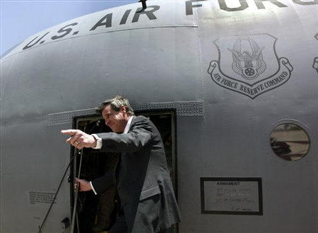 U.S. Administrator L. Paul Bremer III who arrived last May, bids farewell as he boards a C-130  Air Force plane at Baghdad International Airport for his flight out of Iraq, June 28, 2004.