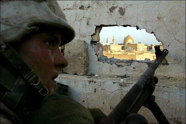 Marines watched the shrine as they continued to recieve sniper fire, Najaf, evening August 26, 2004.
