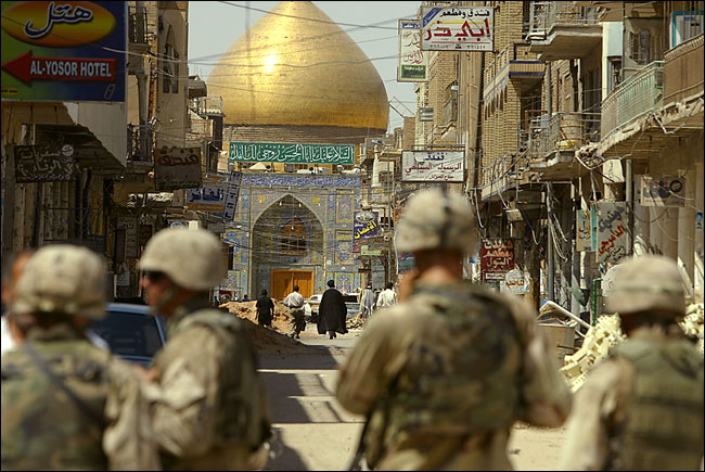 Marines patrolled the streets of Najaf today, near the entrance of the Imam Ali Shrine, as Iraqi police prepared to move up to its doors, morning August 27, 2004.