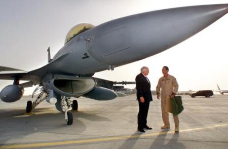 Dick Cheney inspects an F-16 fighter at Al-Udeid Air Base outside Doha, Qatar.