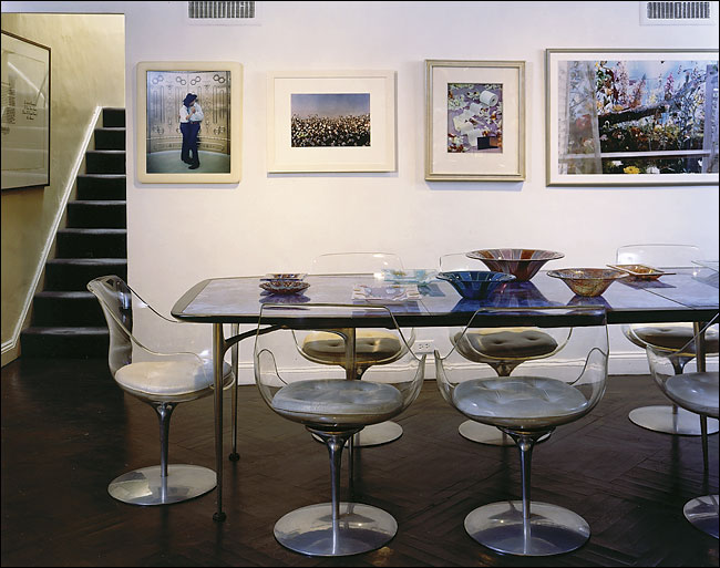 The rear of the famed double-height living room of the New York collector Barbara Jakobson contains a 1958 dining table by Donald Deskey, the designer of Radio City Music Hall's interiors, and eight plexiglass-and-aluminum Champagne chairs, which were designed in 1957 by Erwine and Estelle Laverne, photographed Roger Davies for The New York Times
on collector's declaration of selling some parts of her house collection, Upper East Side of New York, April 2005.