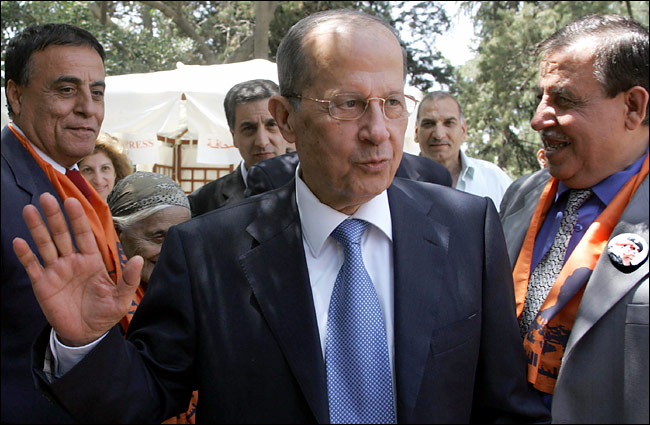 The formerly exiled Gen. Michel Aoun flanked by a slate of candidates outside his home in Rabiye, Lebanon, May 13, 2005.