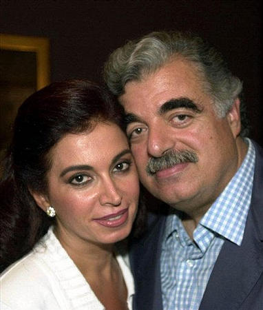 Former Lebanese Prime Minister Rafiq Al-Hariri poses with his wife Nazek at his house in Beirut, September 3, 2000.