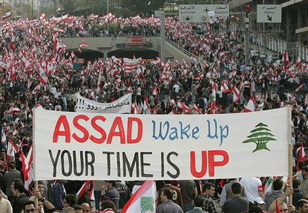 About 100,000 anti-Syrian demonstrators converged on Martyrs' Square, repeatedly chanting 'Syria out!' and most waving Lebanon's distinctive red and white flag with a green cedar tree, Beirut, Lebanon, March 7, 2005. 