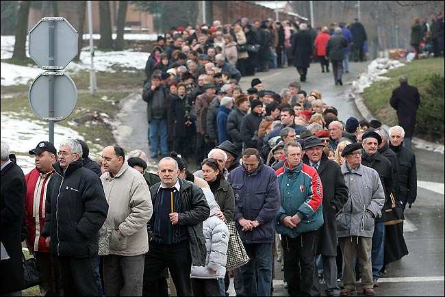 Thousands of supporters of former President Slobodan Milosevic wait in Belgrade, to pay their respects at the Museum of Revolution, where his coffin was on display, the day before the body is to be taken to Pozarevac, his hometown, for a funeral service and burial, March 17, 2006.
