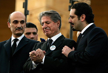 Former Lebanese President Amin Gumayel (C) is comforted by Parliament majority leader Saad Hariri (R) and Samir Geagea, leader of Christian Maronite Lebanese Forces, at the funeral of his son, assassinated Industry Minister Pierre Gumayel, Beirut, Lebanon, November 23, 2006.