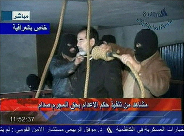 A frame grab from Iraqi state television, Al Iraqiya, shows a noose being placed around Saddam Hussein’s neck before his hanging, Baghdad, early December 30, 2006.