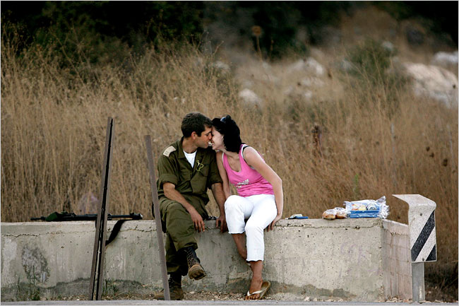 Near Manara, a soldier, is reunited with his wife, Israel, August 14, 2006.