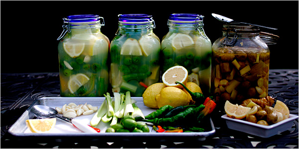 An Egyptian recipe of jars of packed fresh green olives with whole garlic cloves and hot peppers, sliced celery and lemons and covered it all with brine, vinegar and lemon juice.