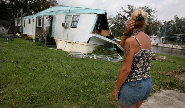 Though Hurricane Gustav nearly missed New Orleans, it caused some damage that such owners assess next day the storm had passed through, September 4, 2008.
