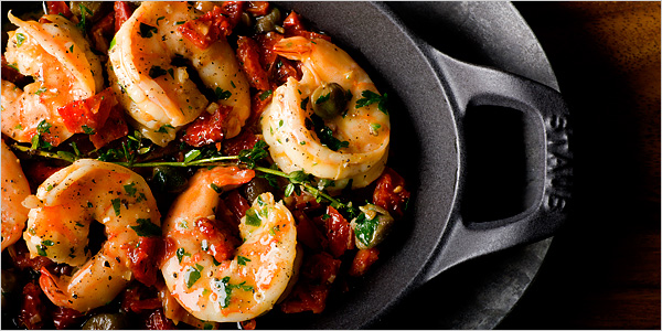 Sun-dried tomatoes blend with capers and thyme in a briefly broiled shrimp dish.