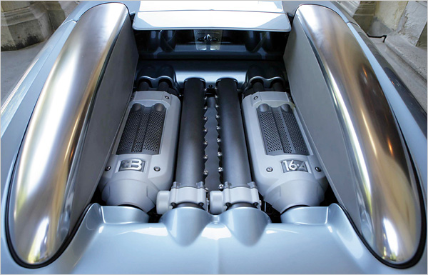 The Veyron's 16-cylinder, 4-turbo, 1,001-horsepower engine resides behind the seats.