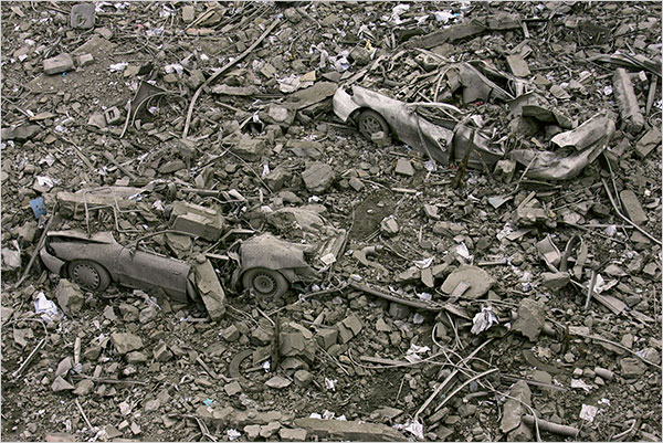 On the fourth day of Israel’s massive attack on Hamas sites throughout Gaza in retaliation for the recent rocket fire from the area, cars buried under rubble at the site of the compound buildings linked to the Islamic University, the home of a top Hamas commander, Gaza City, December 30, 2008.
