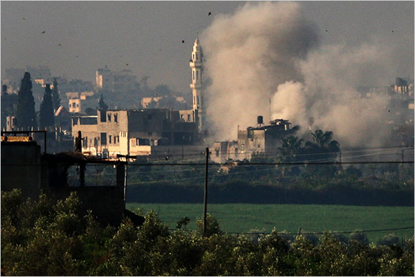 On the tenth day of Israels war against Gaza, smoke rises over a mosque in the Gaza Strip after a Hamas target was bombed by the Israeli army, January 5, 2009.