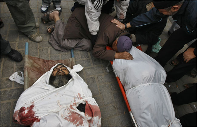 On the sixteenth day of Israel’s war against Gaza, Palestinians mourn over the bodies of relatives, Gaza City, January 11, 2009.
