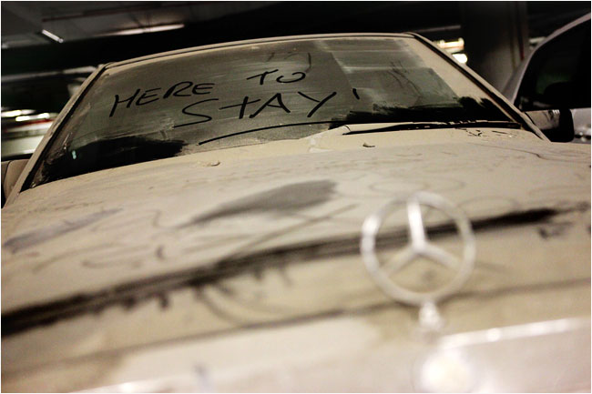 An abandoned car in a parking garage in Dubai, as a report says 3,000 cars were sitting abandoned at the Dubai Airport, February 2009.