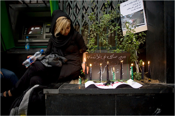 Young people mainly dressed in the latest Western fashions mourn eight protesters killed in demonstrations against the Islamic regime, Tehran, night of June 18, 2009.