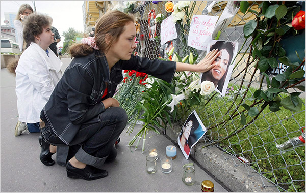 Hundreds of Michael Jackson's fans gather to set up a makeshift memorial in front of the U.S. embassy, Moscow, June 26, 2009.