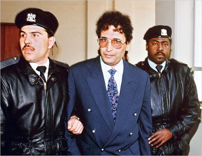The Pan Am Flight 103 over-Lockerbie-bomber, Abdul-Basset Ali Al-Maqrahi, surrounded by security officers, Tripoli, 1992.