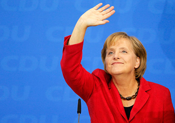 Chancellor Angela Merkel of Germany wave to supporters after the first exit polls were released in the German general election, Berlin, September 27, 2009.