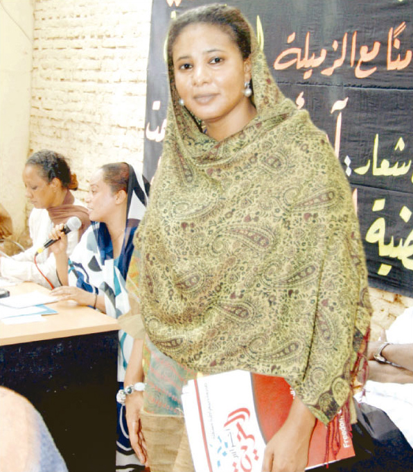 Lubna Hussein, the Sudanese journalist and former United Nations worker, whom to be arrested in July 3, 2009 and trialed of 'indecent dressing,' for wearing trousers in public, a charge that could lead her to being flogged with 40 lashes, poses to camera during a female activists meeting, Khartoum, June 14, 2009.