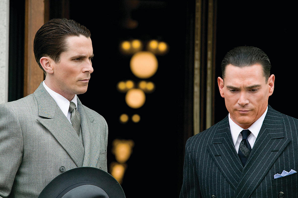 Christian Bale as legendary Depression-era outlaw John Dillinger's nemesis, Special Agent Melvin Purvis, and Billy Crudup as FBI director J. Edgar Hoover, in 'Public Enemies' (2009)