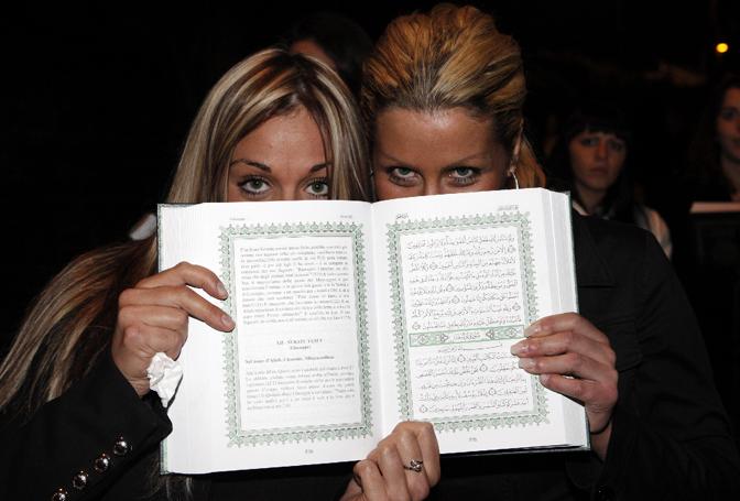 Hundreds of glamorously dressed women, aged between 18 and 35 years old, employed by an Italian modeling agency and taken to the Libyan Ambassador’s residence, just to find the Libyan leader Muammar Al-Qaddaf giving each of them a copy of the Quran and enticing them to convert to Islam, Rome, November 15, 2009.