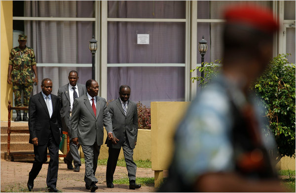 The powerless Alassane Ouattara, center, the winner of Ivory Coast’s notorious presidential election run by the United Nations, with advisers and staff members in the hotel they are sieged inside, Abidjan, Ivory Coast, January 2011.