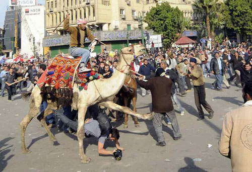 Some of pro-Egypt millions, at one point ride horses and camels through A-Tahrir Square in an attempt to disperse the protesters, downtown Cairo, Egypt, February 2, 2011.
