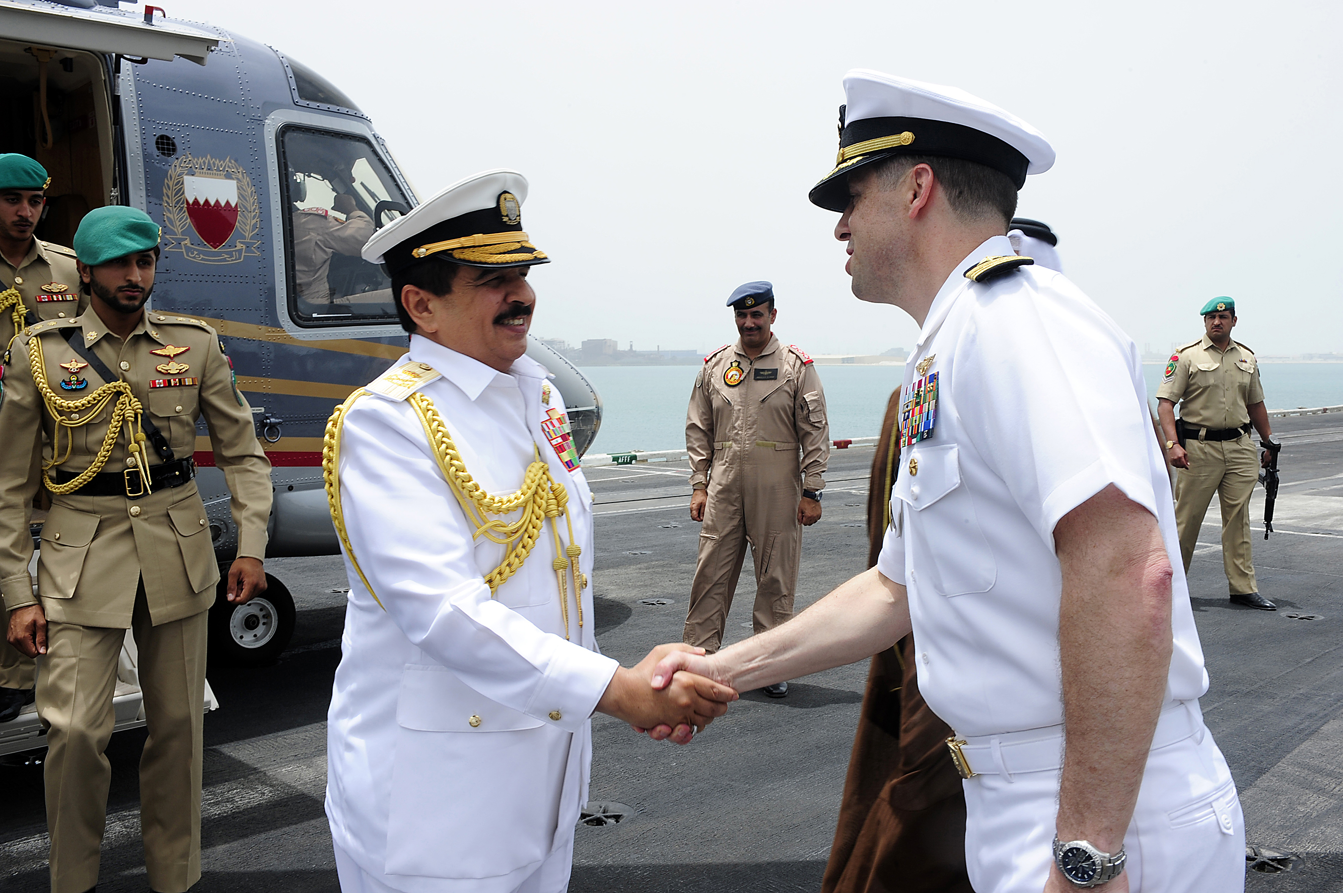 Captain Ted R. Williams, executive officer of the aircraft carrier USS Dwight D. Eisenhower (CVN 69), welcomes the King of Bahrain, His Majesty the King Hamad bin Isa al-Khalifa, to Dwight D. Eisenhower during an historic port visit to the Kingdom of Bahrain, Arabian Sea, May 17, 2009.
