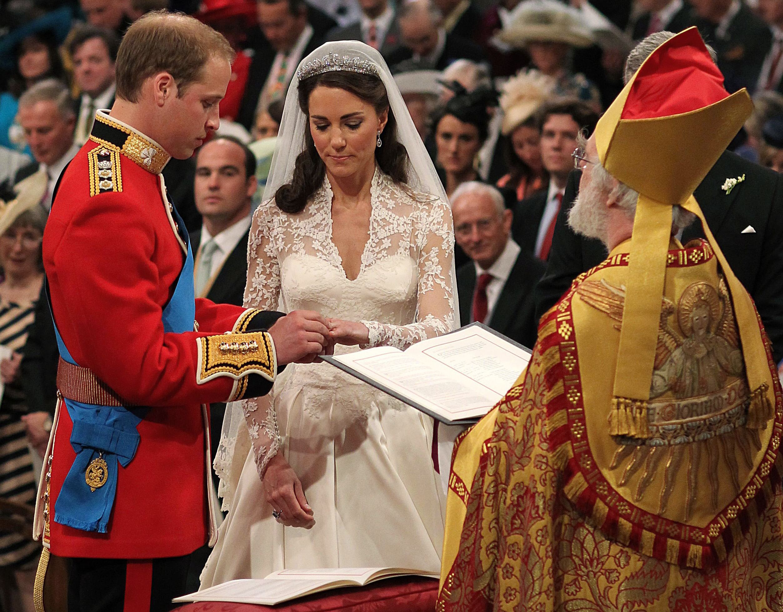 Britain's Prince William and Catherine Middleton, Duchess of Cambridge, exchange rings before the Archbishop of Canterbury, Dr. Rowan Williams, Westminster Abbey, Central London, April 29, 2011.