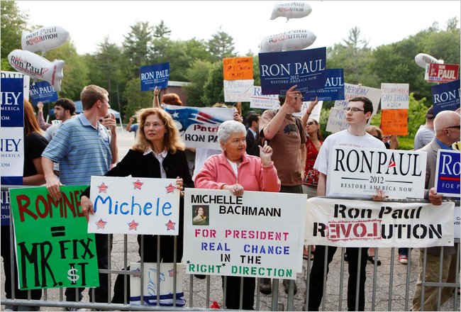 Supporters of Republican presidential hopefuls gather at the first New Hampshire debate of the 2012 campaign at St. Anslems College, Manchester, New Hampshire, June 13, 2011.