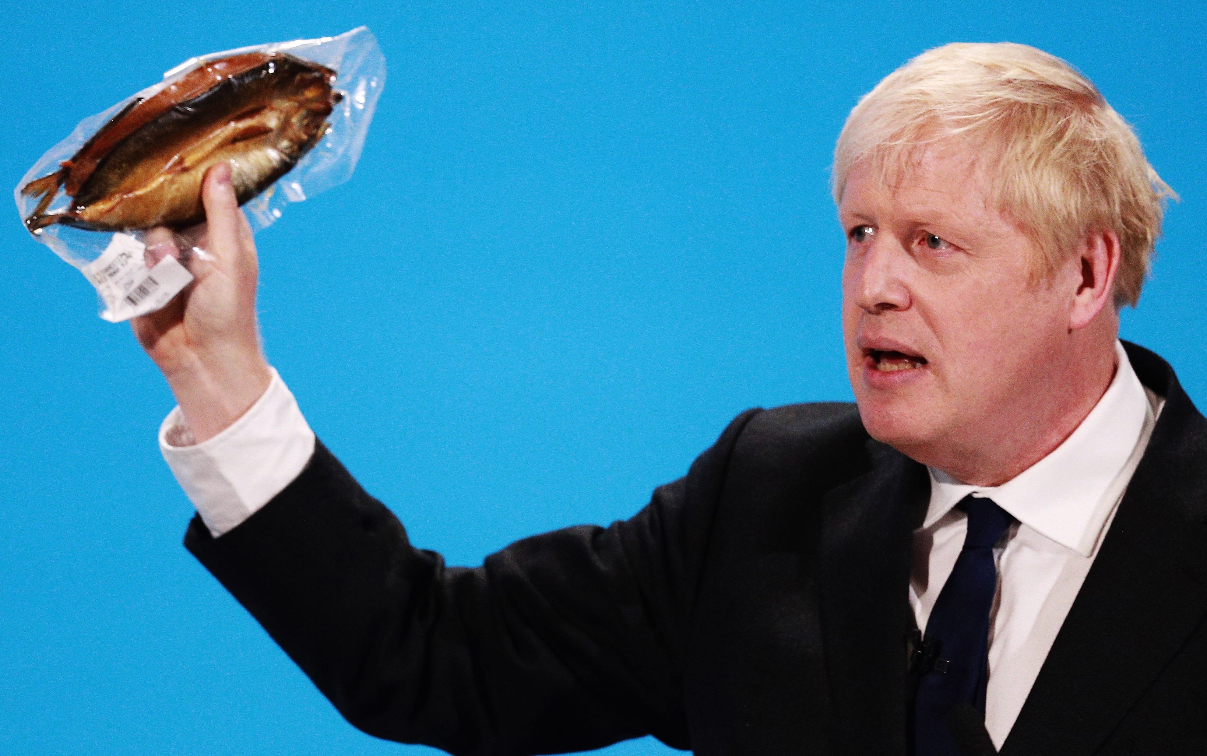 Boris Johnson wafts a kipper on stage as he blasts barmy EU food rules in final Tory leadership hustings, July 17, 2019.