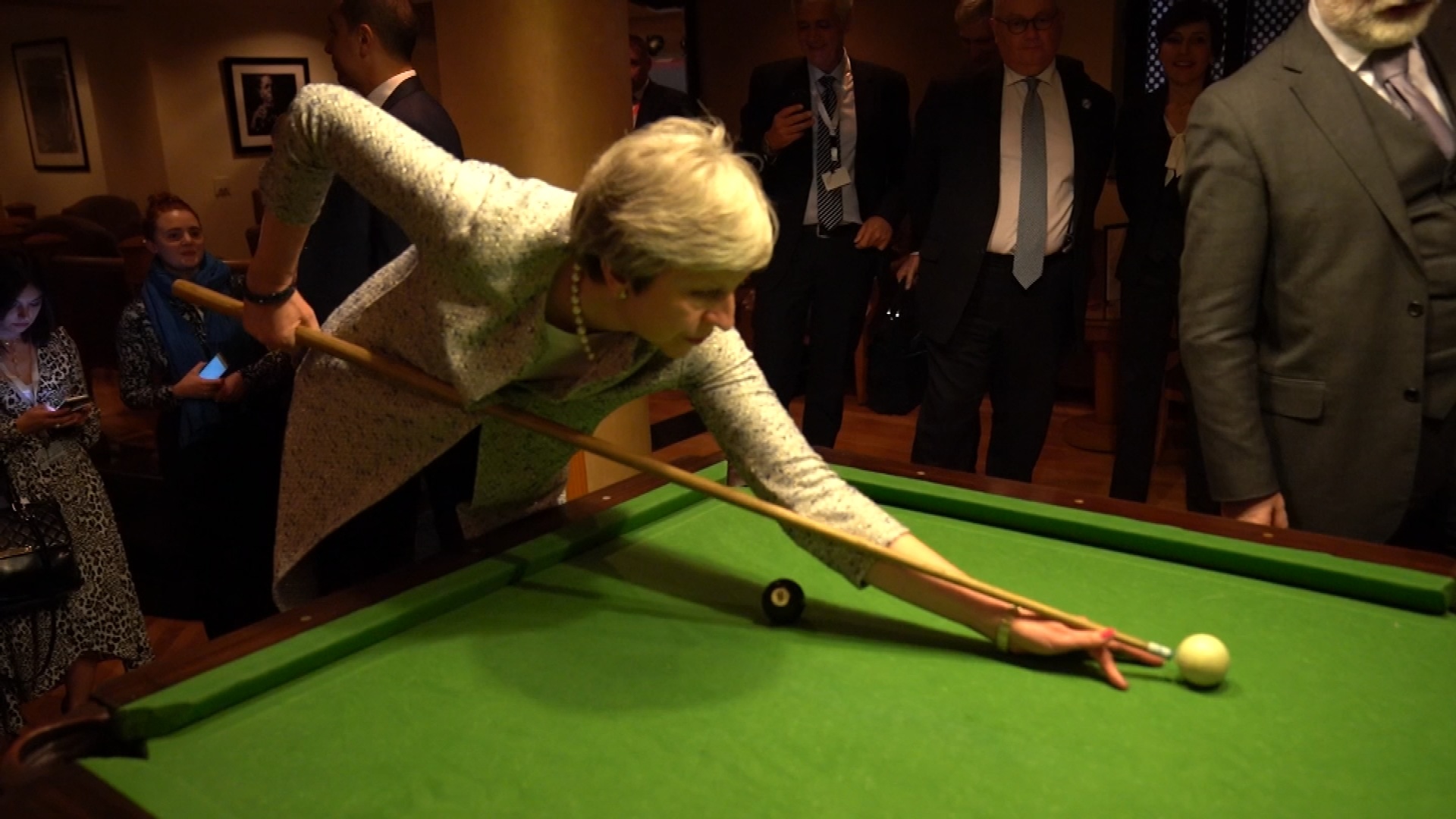 UK Prime Minister Theresa May shoots pool with Italian PM on sidelines of EU Arab League summit, Sharm El-Sheikh, Egypt. February 24, 2019.